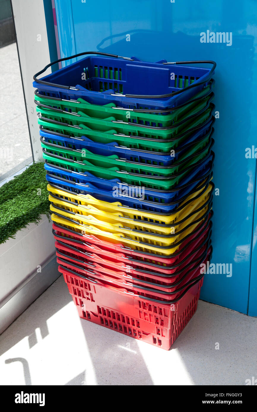 Colorful plastic shopping baskets Stock Photo