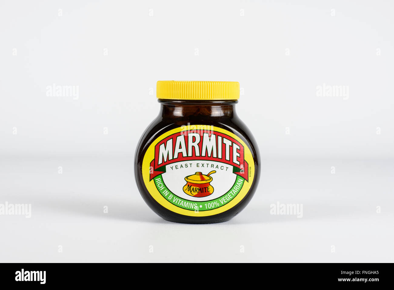 Large jar of Marmite photographed against a white background Stock Photo