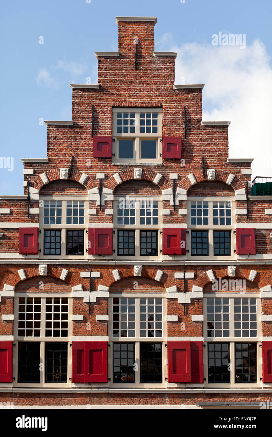 Crow-stepped gable with window shutters in Leiden, Netherlands Stock Photo