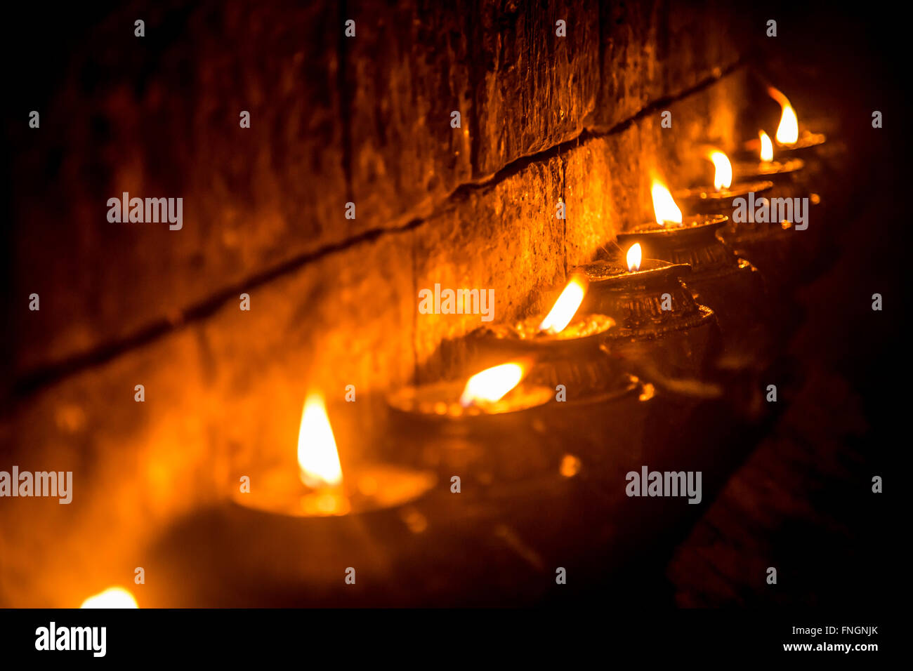 Nepalese candles lighting a temple wall Stock Photo Alamy