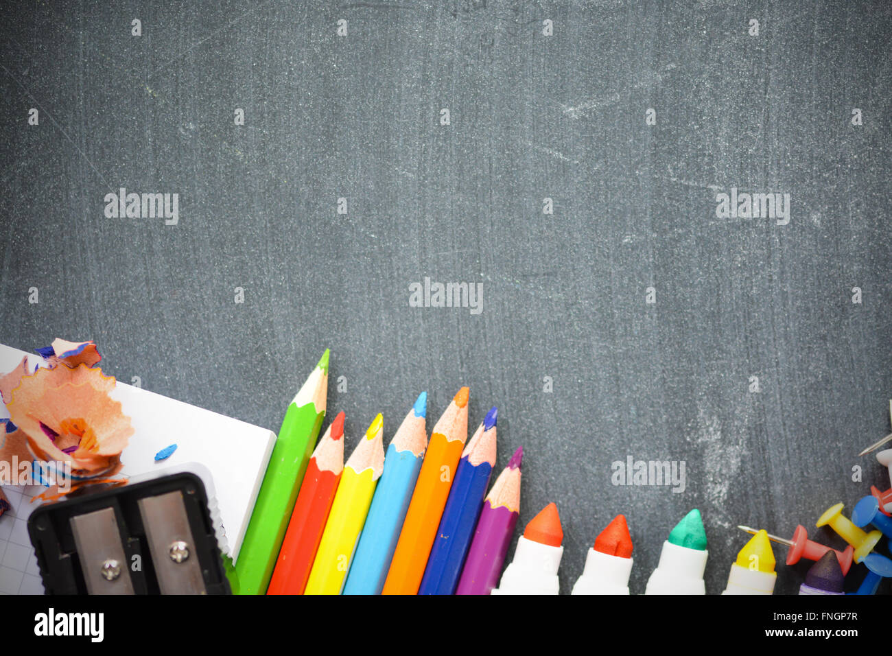 Blackboard background with school supplies suggesting back to school season Stock Photo