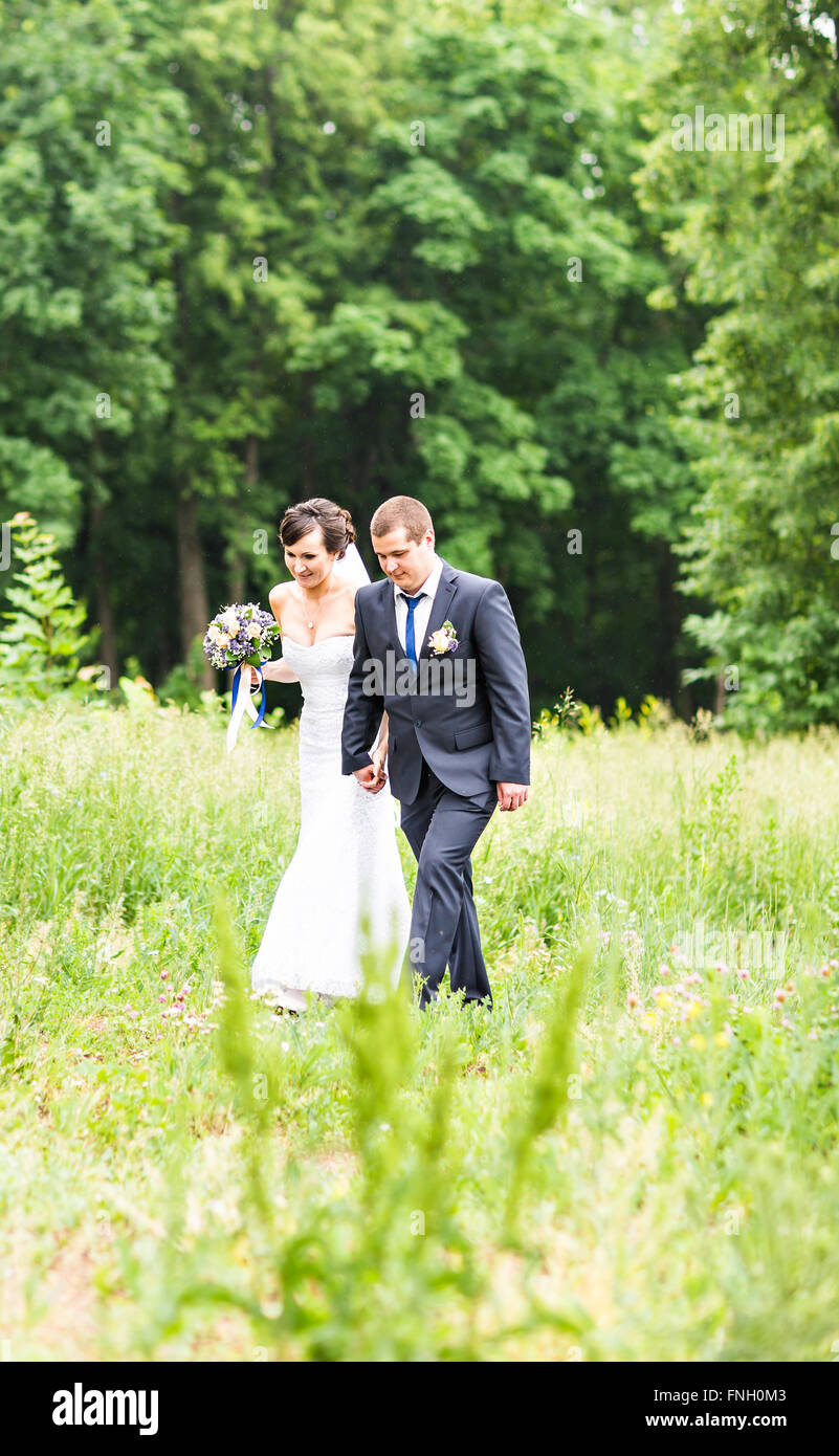 Happy bride and groom on their wedding day Stock Photo - Alamy