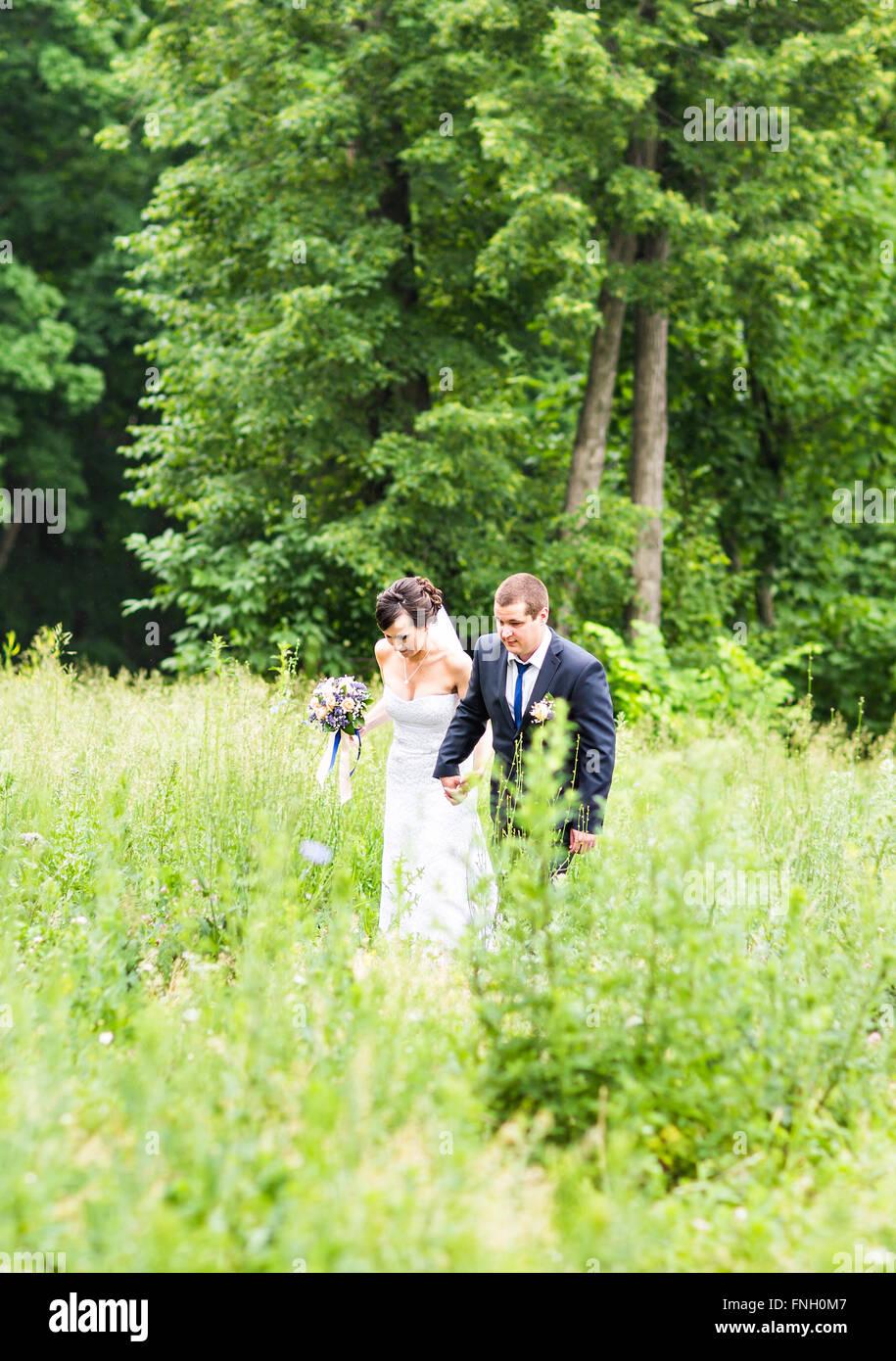 Happy bride and groom on their wedding day Stock Photo - Alamy