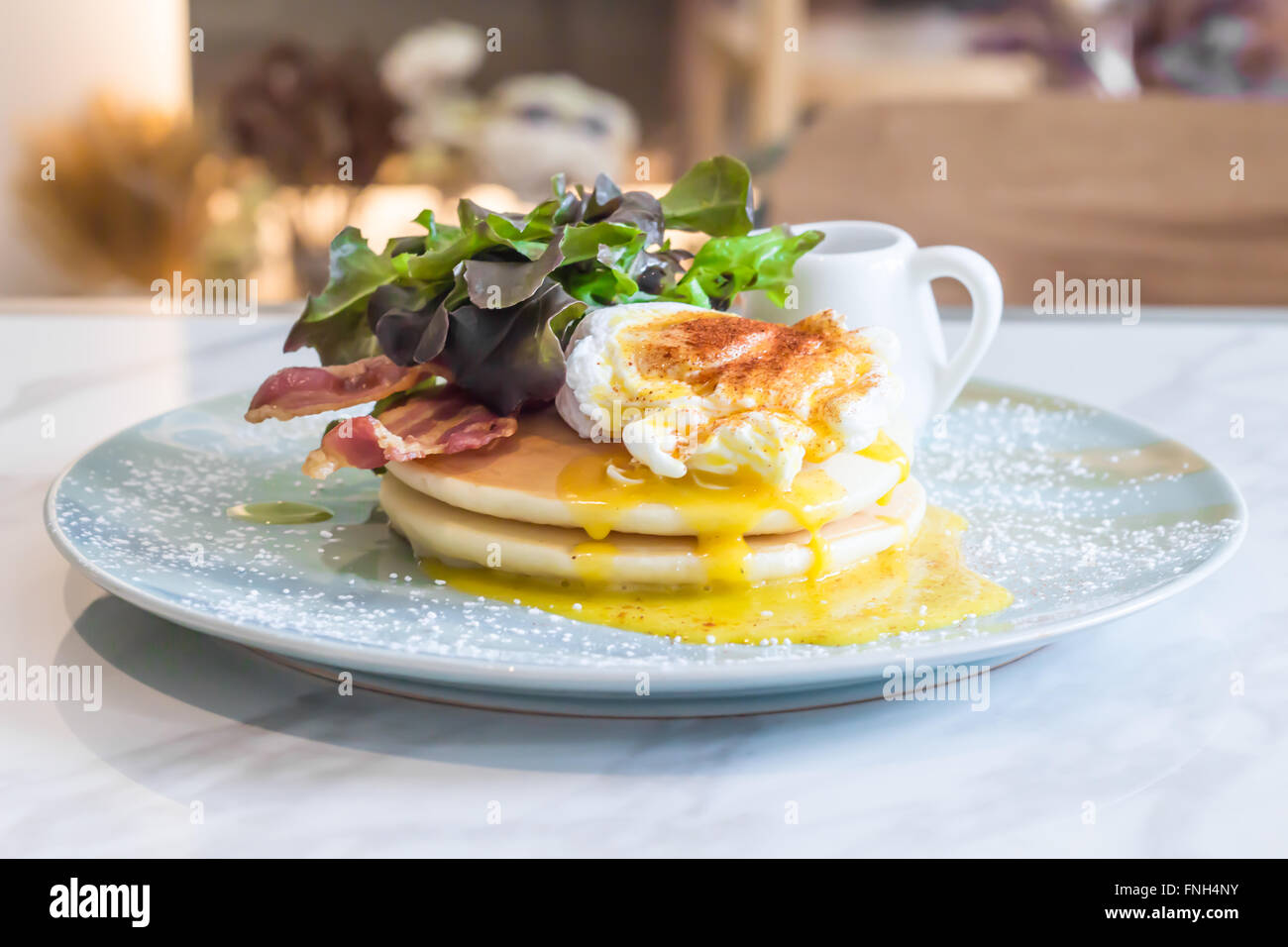 Pancakes with Eggs Benedict Stock Photo Alamy