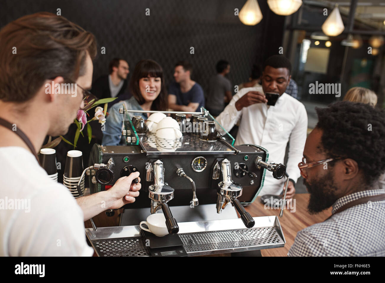 Barista training at an espresso machine in coffee shop Stock Photo Alamy