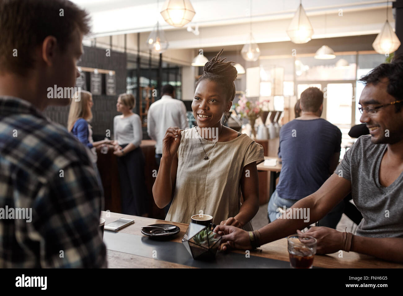 African woman entrepreneur having meeting in a coffee shop Stock Photo
