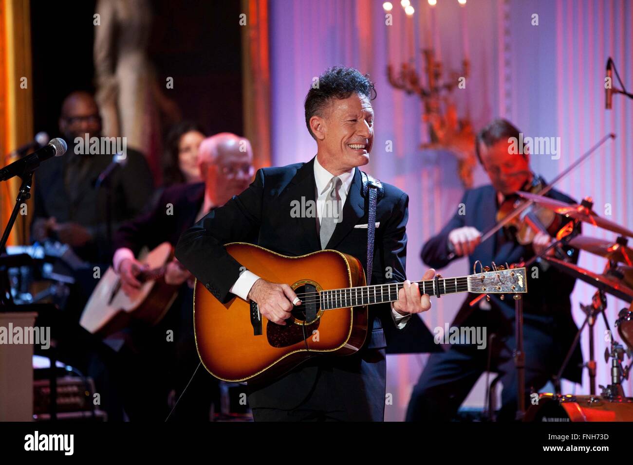 Lyle Lovett performs during the Country Music: In Performance at the White House concert in the East Room of the White House November 21, 2011 in Washington, DC. Stock Photo