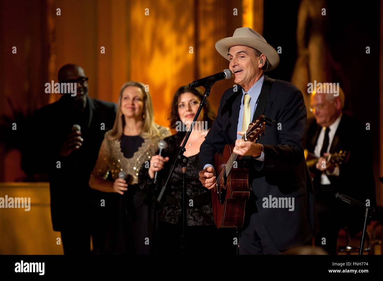 James Taylor performs during the Country Music: In Performance at the White House concert in the East Room of the White House November 21, 2011 in Washington, DC. Stock Photo