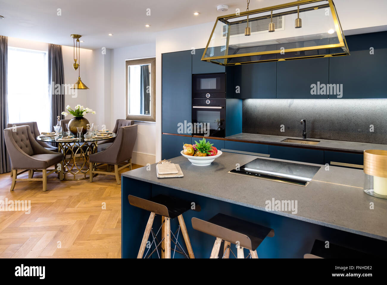 Modern Luxury Kitchen and Living Room Dining Table Stock Photo - Alamy