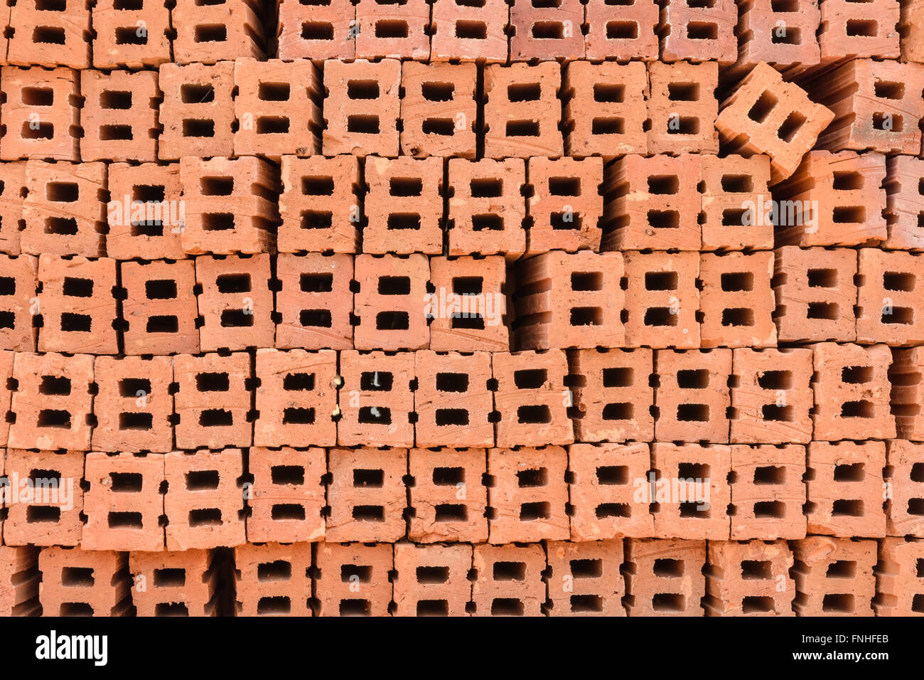 Stack of red clay bricks wall building Stock Photo Alamy