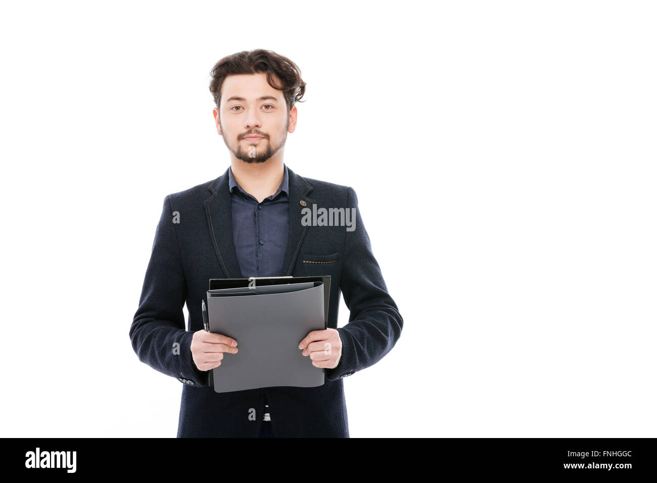 Young businessman holding clipboard isolated on a white background Stock Photo