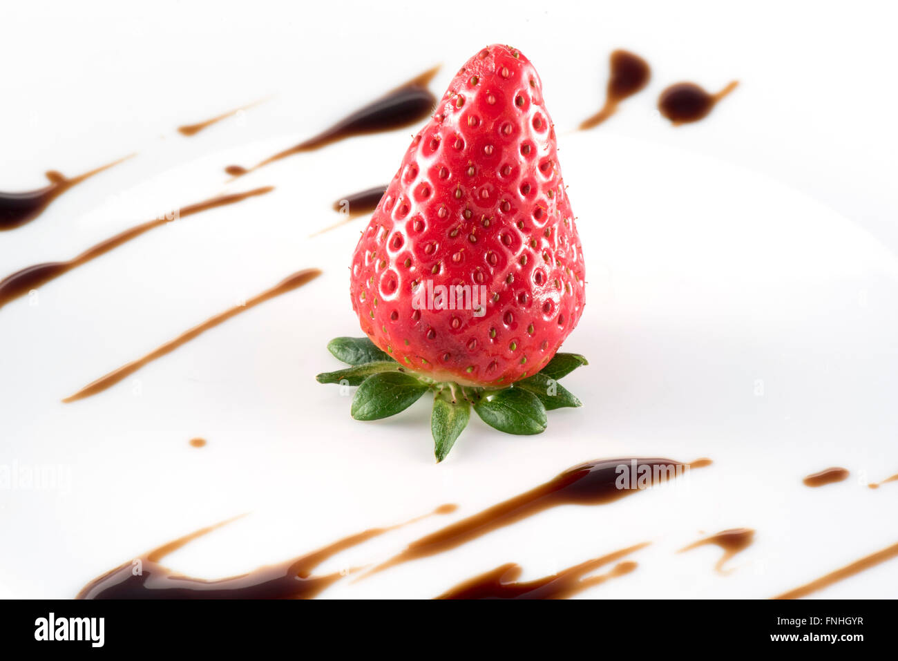 Strawberry with balsamic vinegar on white plate Stock Photo