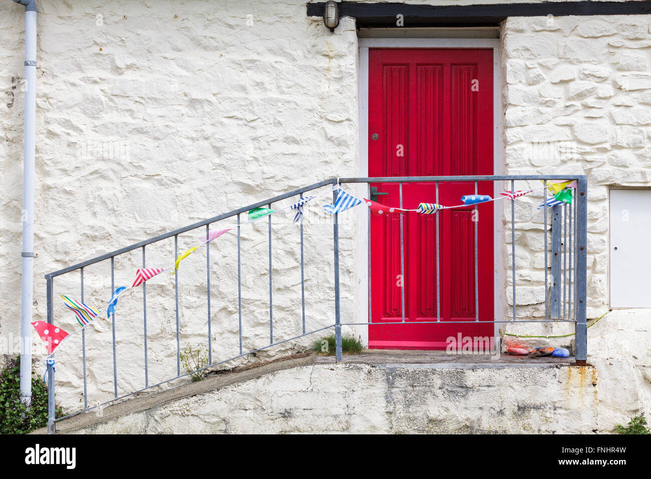 Red Door with bunting. Stock Photo