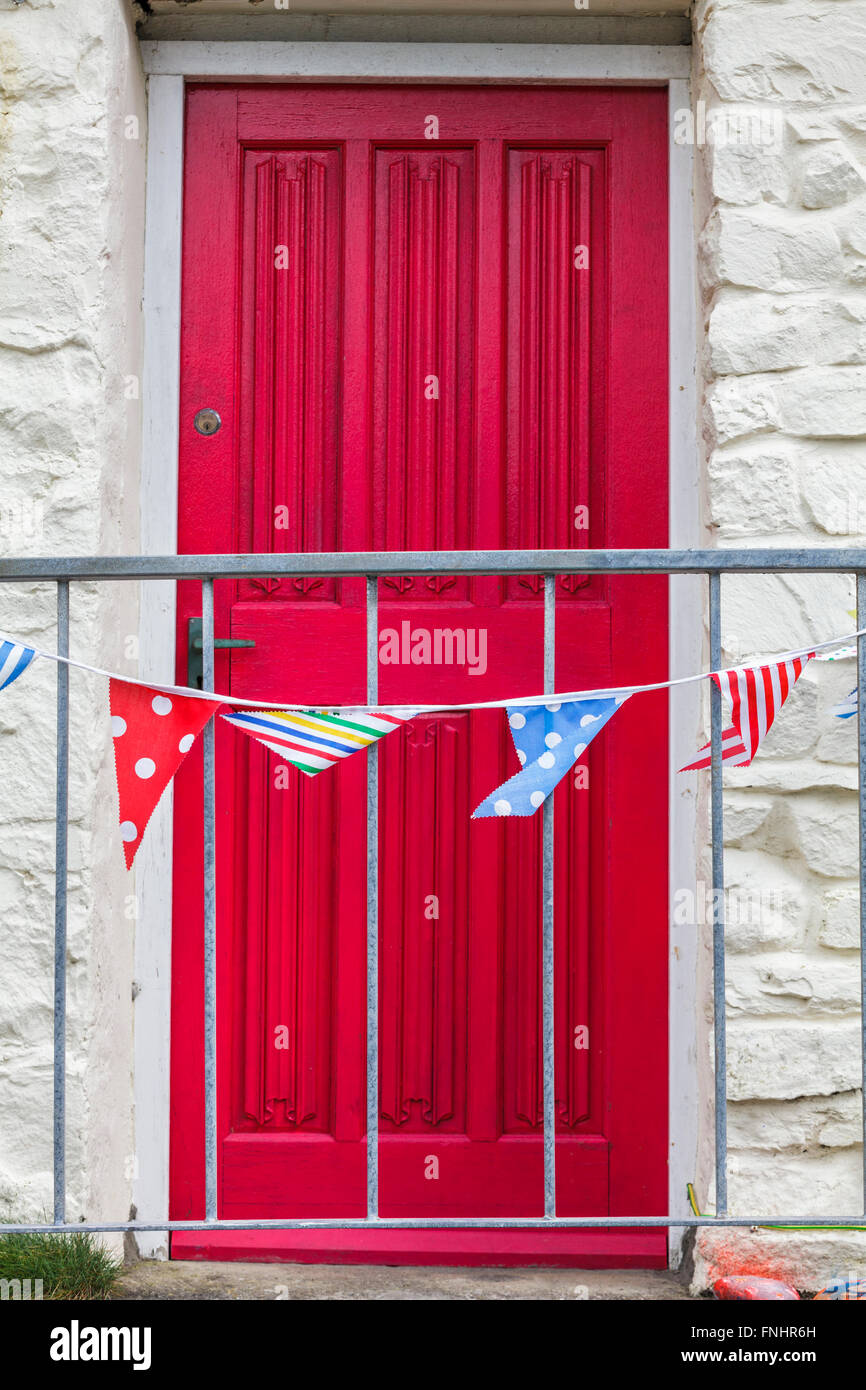 Red Door with bunting. Stock Photo