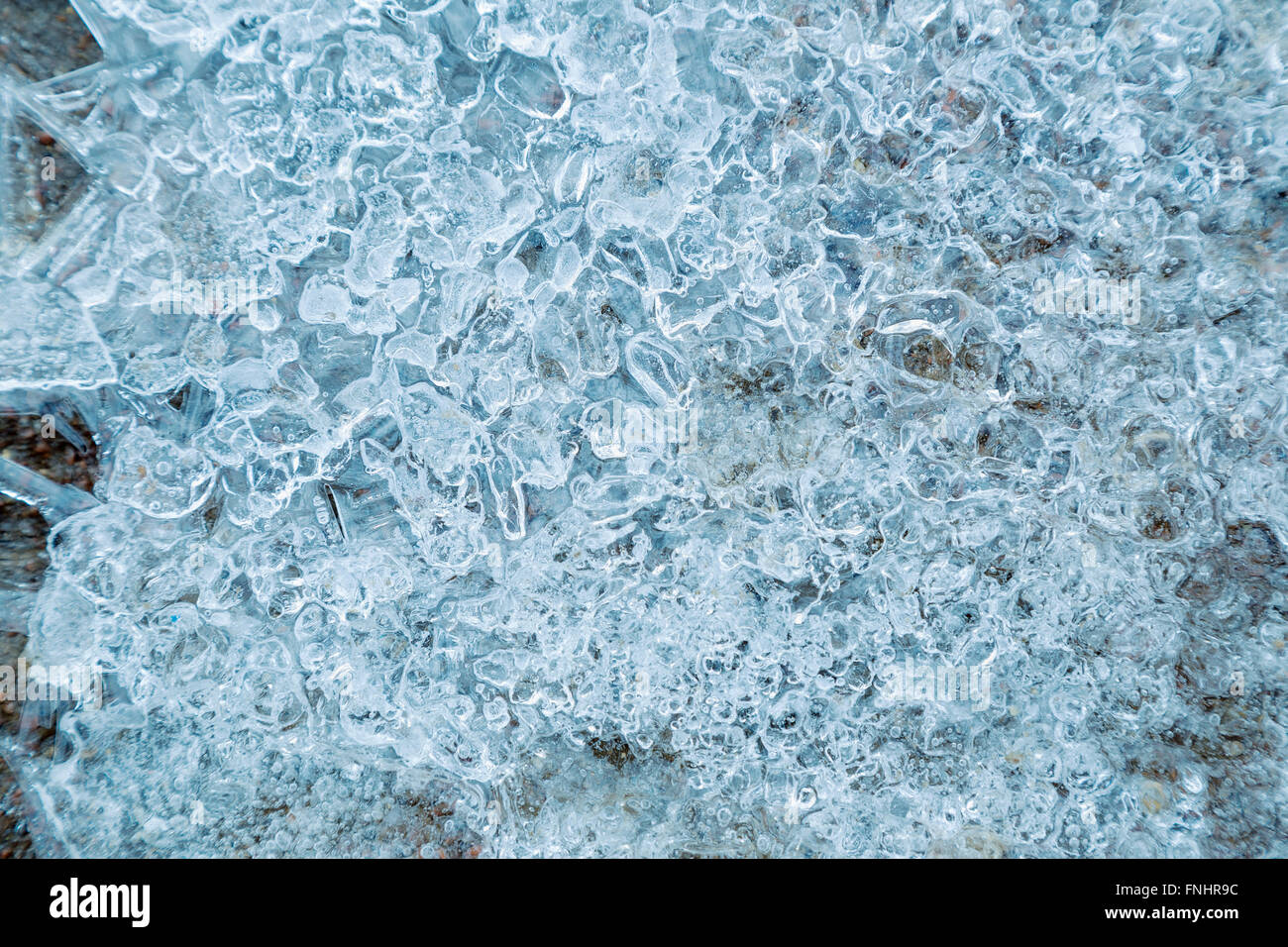 Coated fissures ice with bubbles of air Stock Photo - Alamy