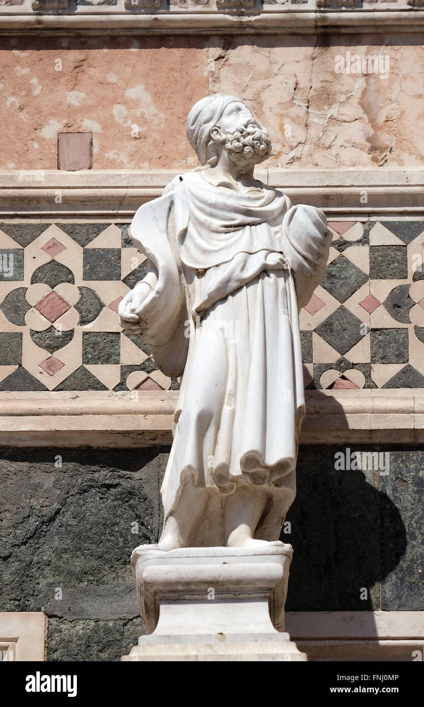 Statue of Prophet attributed to Andrea Pisano, Portal on the side-wall of Cattedrale di Santa Maria del Fiore, Florence, Italy Stock Photo