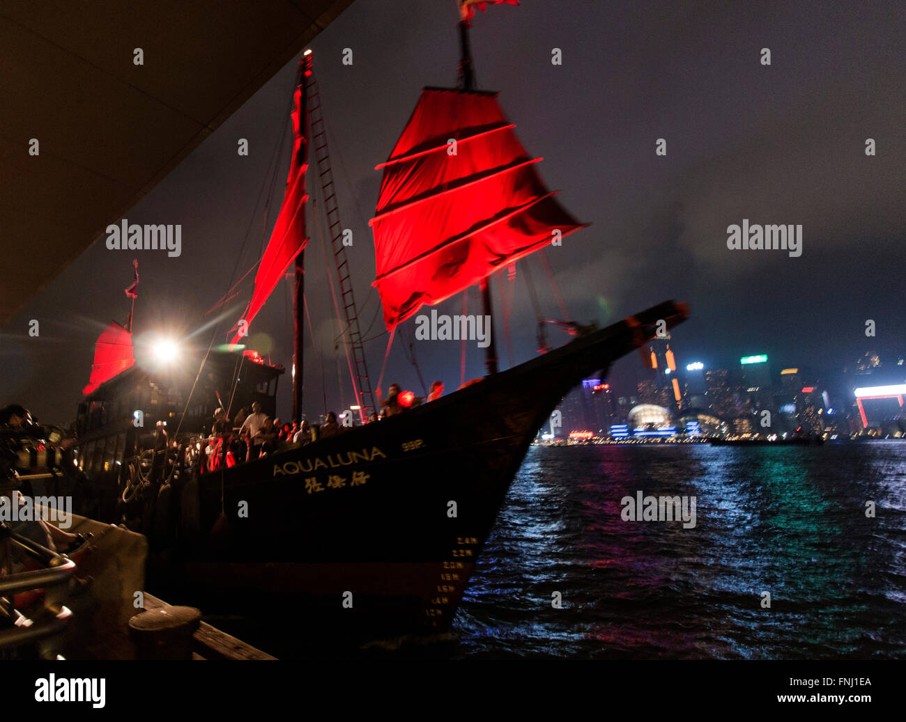 Aqua Luna Chinese pirate sailing boat in Hong Kong Victoria Harbour by night Stock Photo