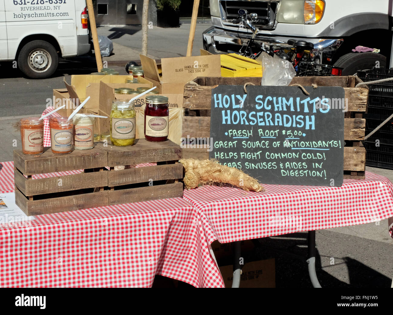 A stand at Union Square Market selling various types of horseradish all grown on Long Island. Stock Photo