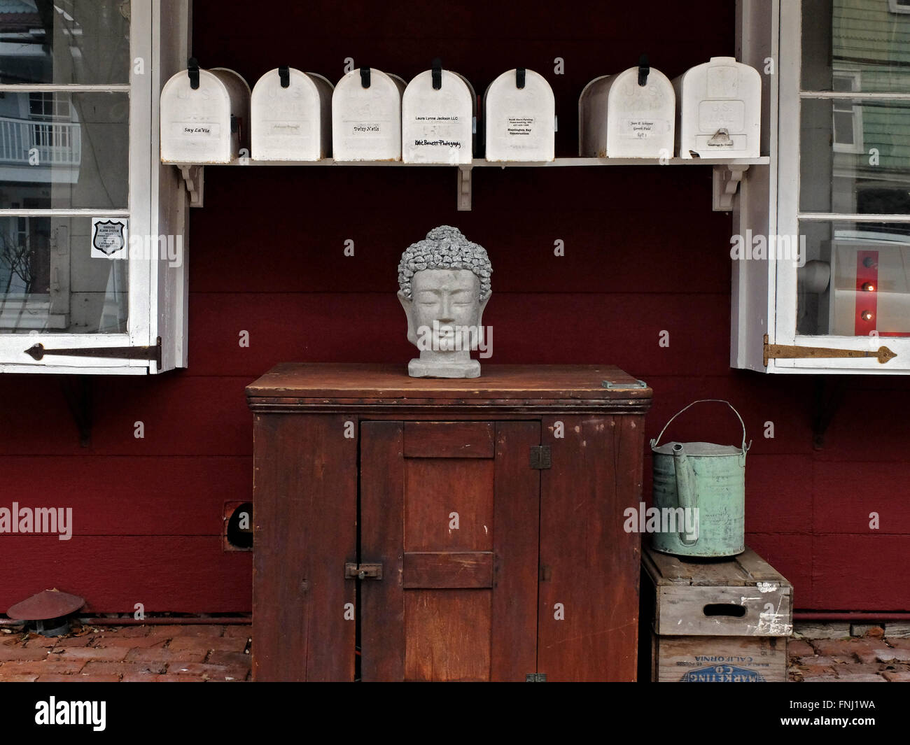 A rural scene with old fashioned mailboxes and a statue on Main Street in Cold Spring Harbor, Long Island Stock Photo