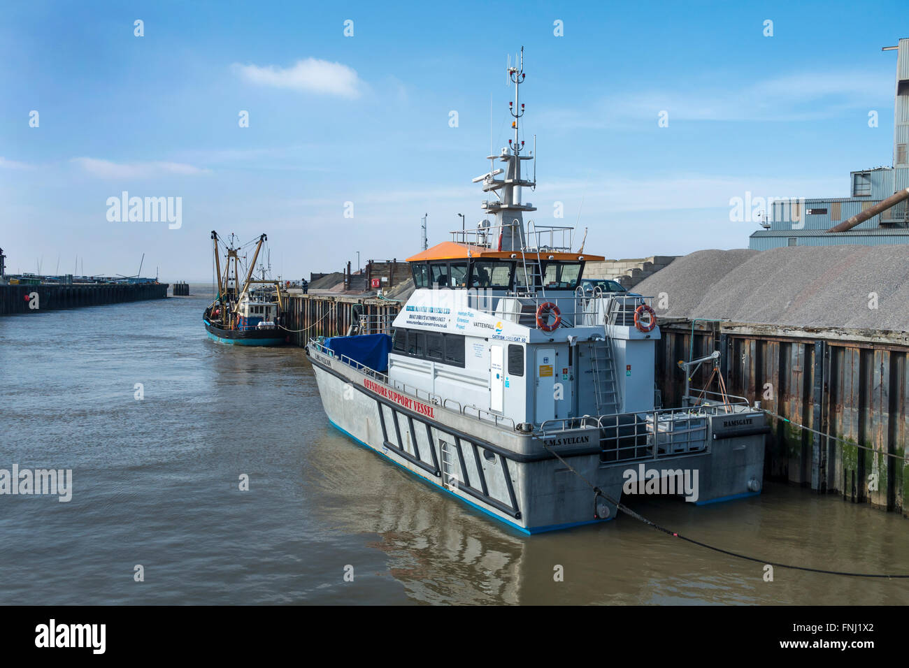 EMS Vulcan Offshore Support Vessel and Arie Dirk Fishing Trawler in Whitstable Harbour Stock Photo
