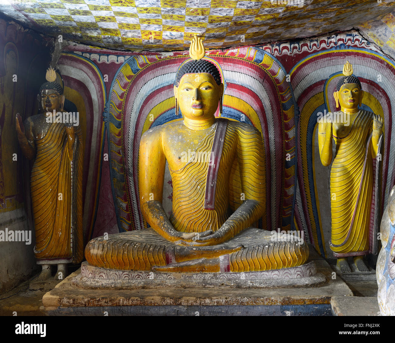 Insides of caves in ancient Buddhist complex in Dambulla cave temple. Sri Lanka. The photograph is presenting the statue of Budd Stock Photo
