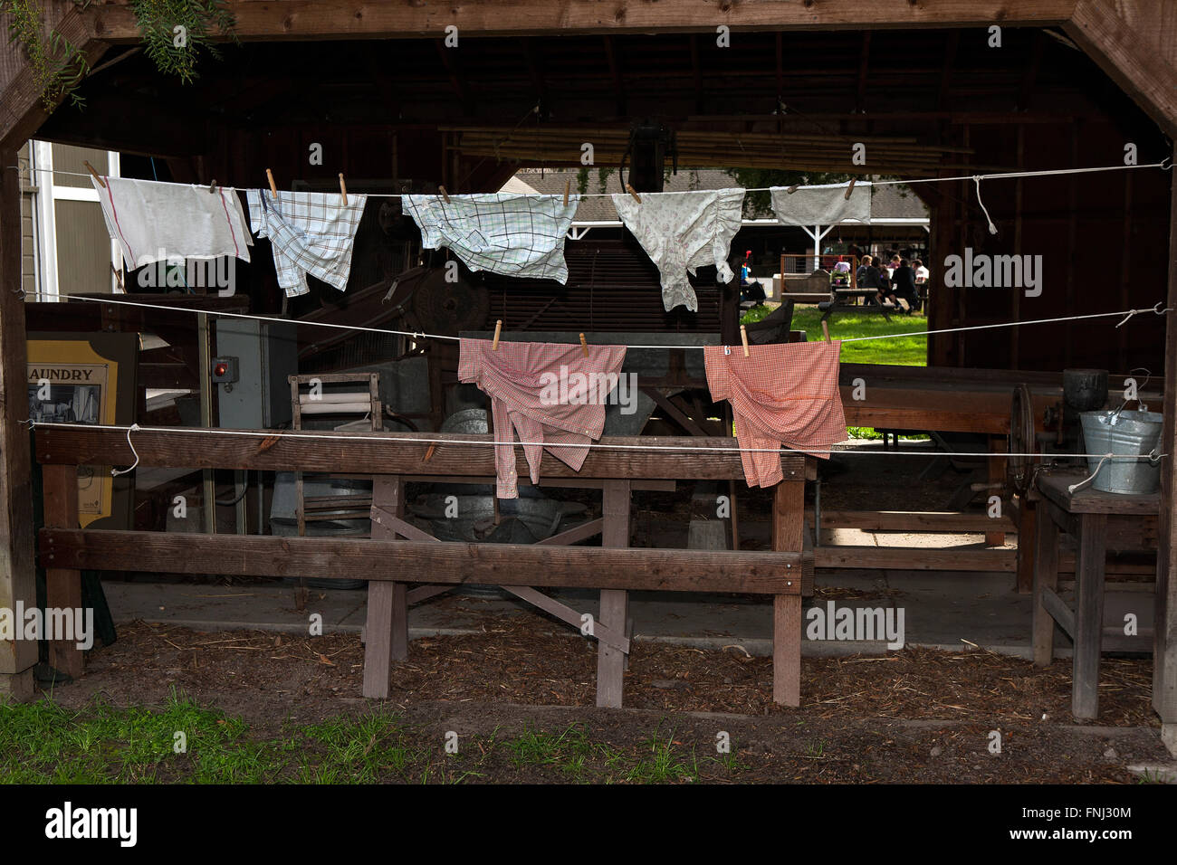 Clothes on a clothesline next to a barn, Ardenwood Historic Farm, Fremont, California, United States of America Stock Photo