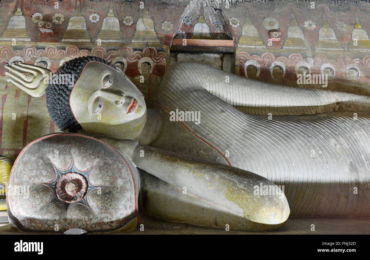 Insides of caves in ancient Buddhist complex in Dambulla cave temple. Sri Lanka. The photograph is presenting the statue of Budd Stock Photo
