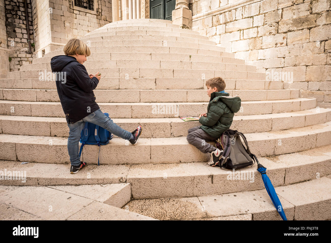 Schoolchildren playing in the old city of Dubrovnik, Croatia. Stock Photo