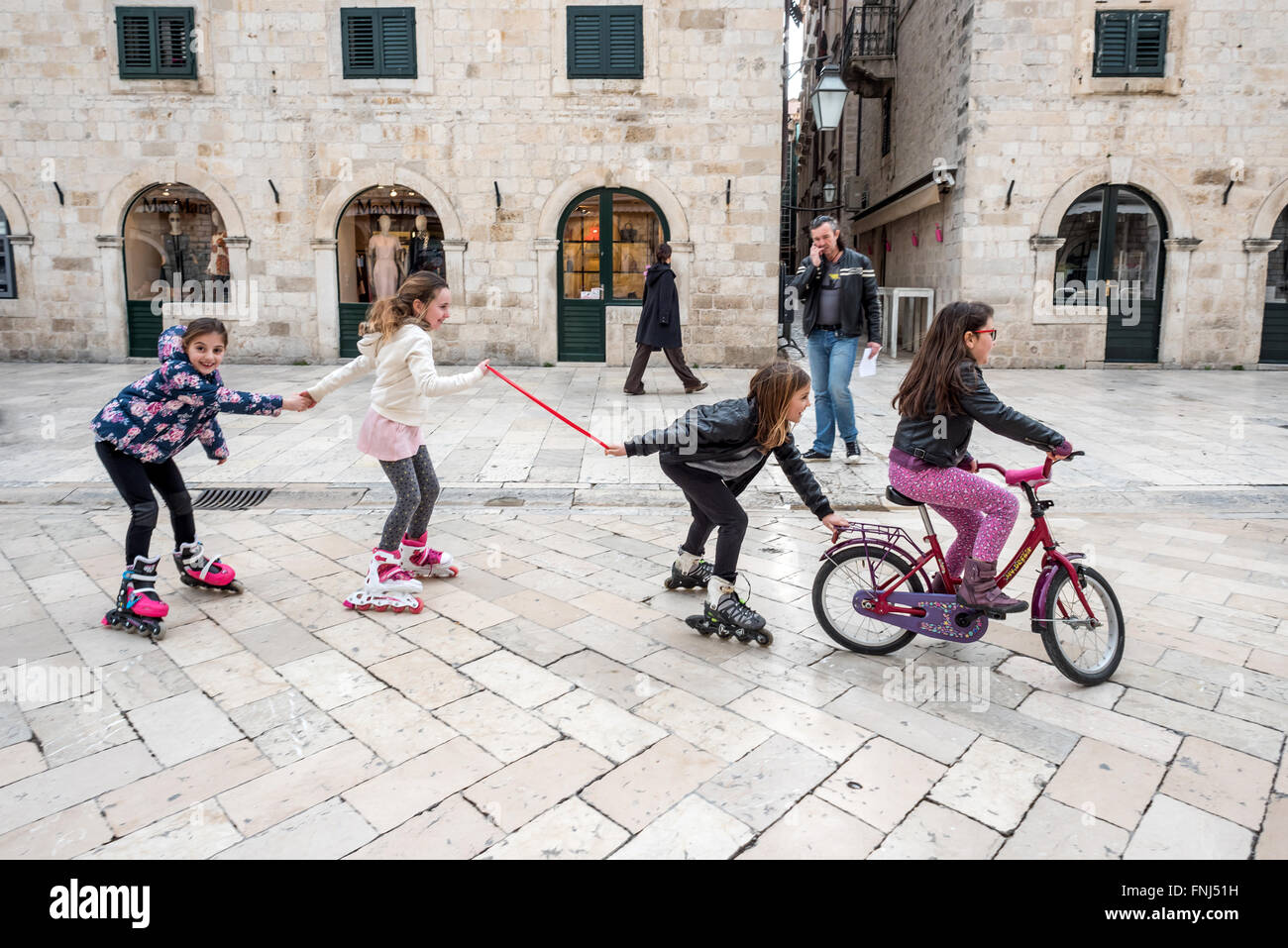 Children playing on the street in the old city of Dubrovnik, Croatia. Stock Photo