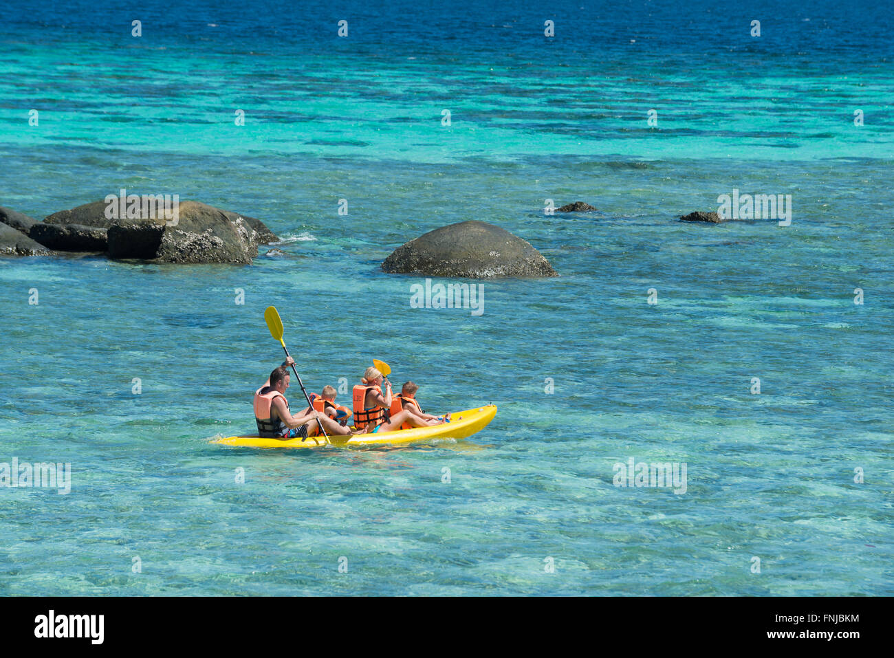Family with two kids on Kayak in Andaman sea, Ko Lipe, Thailand Stock Photo