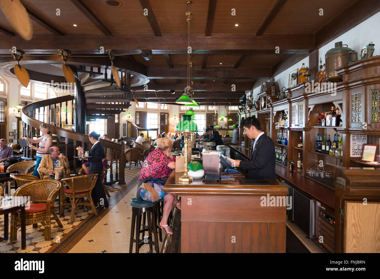 Interior of the famous Long Bar In Raffles hotel, Singapore Stock Photo