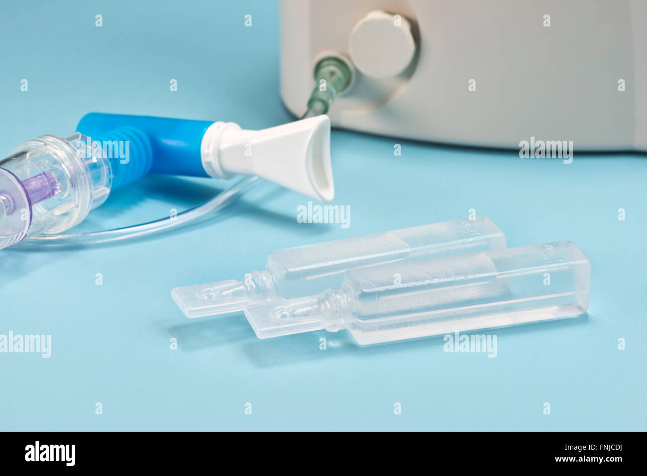 Sterile saline vials with nebulizer and mouthpiece. Stock Photo