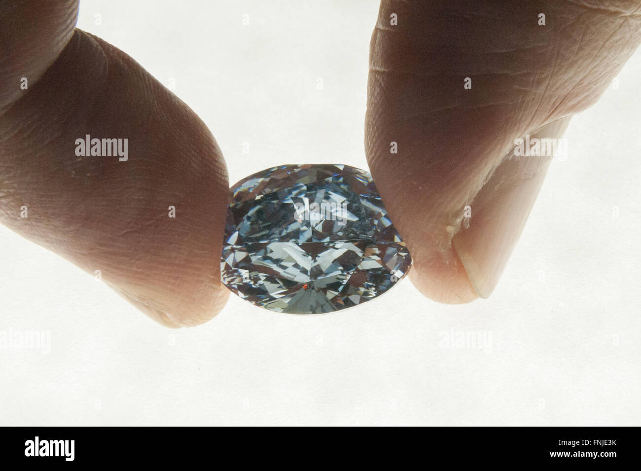 London, UK.  15 March 2016.  The ‘De Beers Millennium Jewel 4’, a rare and superb oval internally flawless fancy vivid blue diamond weighing 10.10 carats is displayed at Sotheby's in New Bond Street ahead of its auction in Hong Kong on 5 April.  It is the largest oval fancy vivid blue diamond ever to appear at auction (Est. HK$235 – 280 million / US$30 – 35 million) and is the only oval-shaped stone among the twelve rare diamonds - eleven blue and one colourless – that form the world-renowned De Beers Millennium Jewels collection. Credit:  Stephen Chung/Alamy Live News Stock Photo