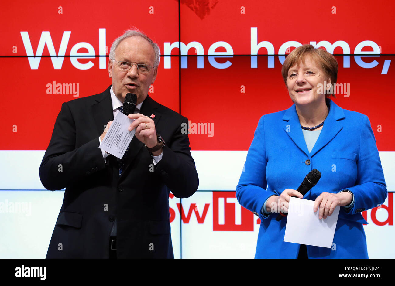 Hanover, Germany. 15th Mar, 2016. German chancellor Angela Merkel (R) and Swiss President Johann Schneider-Ammann visit the CeBIT 2016 in Hanover, central Germany, on March 15, 2016. Switzerland is the partner country of the CeBIT 2016. Credit:  Luo Huanhuan/Xinhua/Alamy Live News Stock Photo