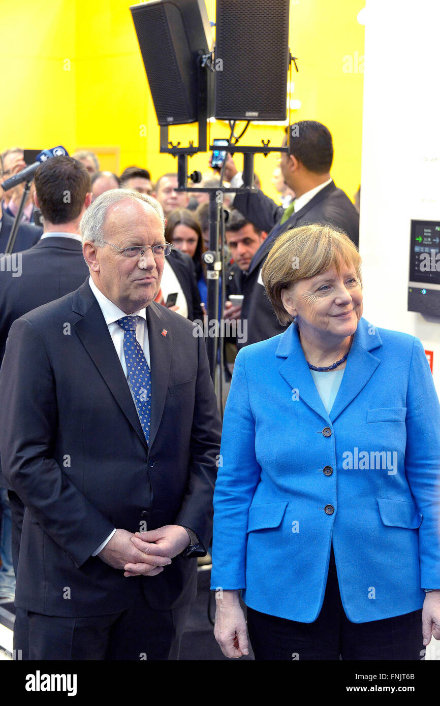 Hanover, Germany. 15th Mar, 2016. Swiss President Johann Schneider-Ammann and German Chancellor Angela Merkel (CDU), during their tour of the CeBIT fair in Hanover, Germany, 15 March 2016. Switzerland is the partner country of this year's CeBIT, which runs until 18 March 2016. Credit:  dpa/Alamy Live News Stock Photo