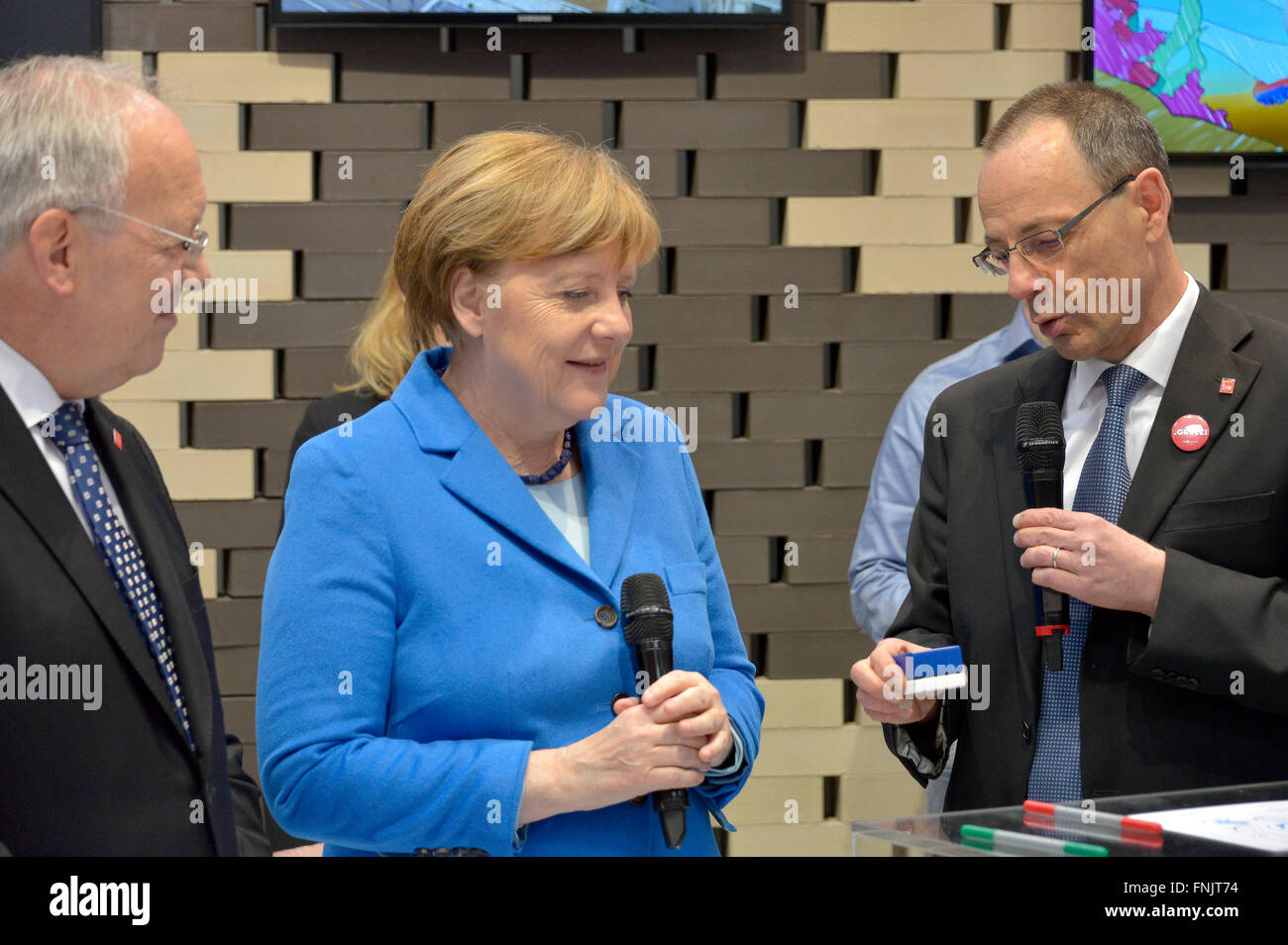 Hanover, Germany. 15th Mar, 2016. Swiss President Johann Schneider-Ammann and German Chancellor Angela Merkel (CDU), during their tour of the CeBIT fair in Hanover, Germany, 15 March 2016. Switzerland is the partner country of this year's CeBIT, which runs until 18 March 2016. Credit:  dpa/Alamy Live News Stock Photo