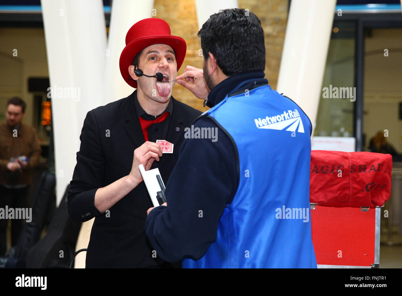 London, UK, 16 March 2016 A Network Rail staff helps Shaun Aimes to