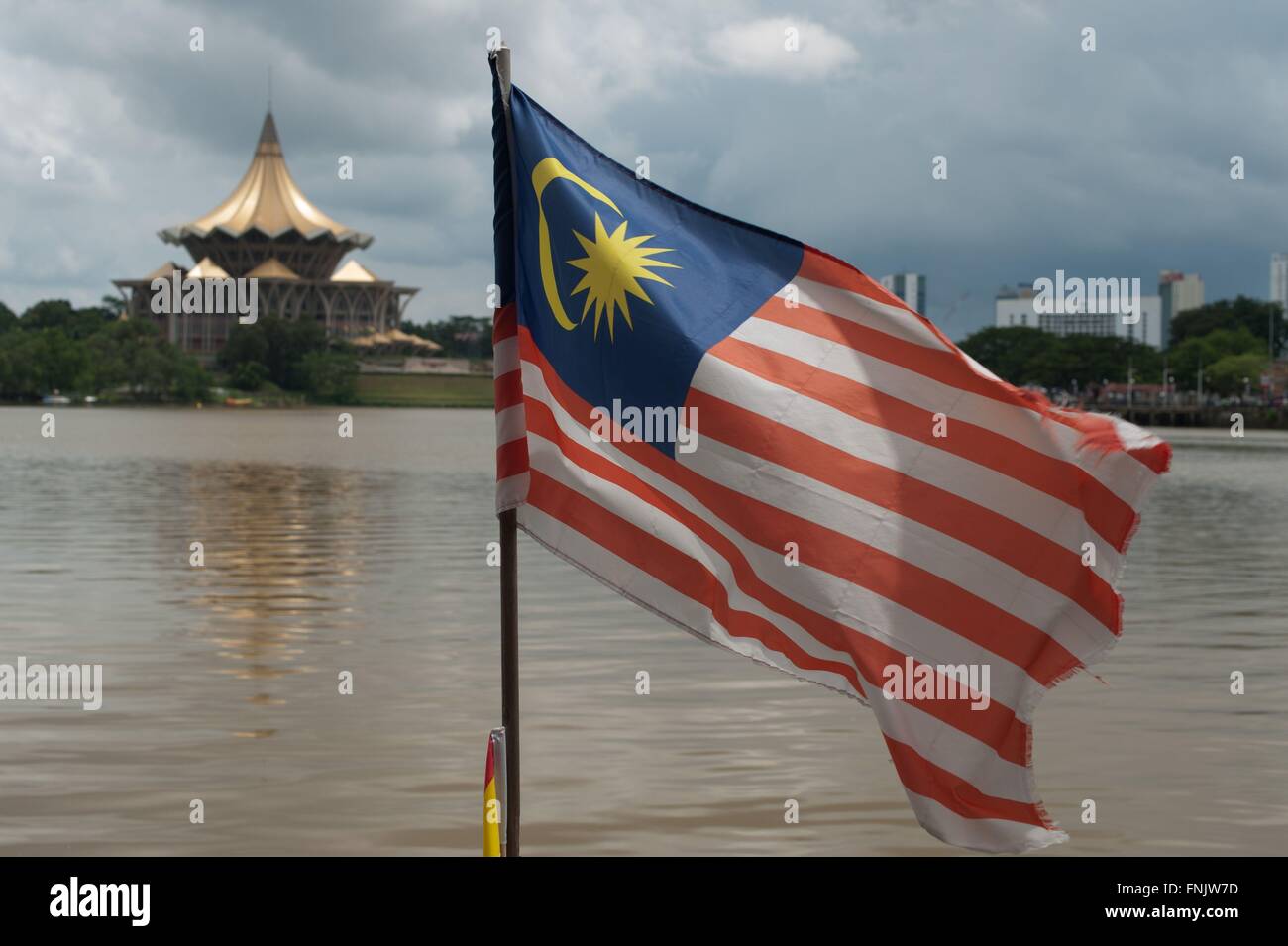 Kuching, Malaysia. 21st Oct, 2014. The Malaysia flag is waving in the wind on the shore of the Sarawak River in front of the Sarawak State Legislative Assembly Building in Kuching, Malaysia, 21 October 2014. Photo: Sebastian Kahnert - NO WIRE SERVICE -/dpa/Alamy Live News Stock Photo