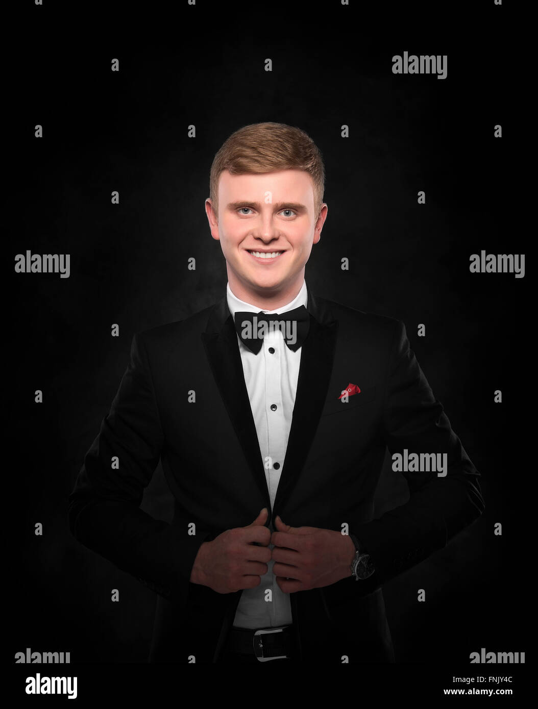Young handsome man in black suit Stock Photo - Alamy