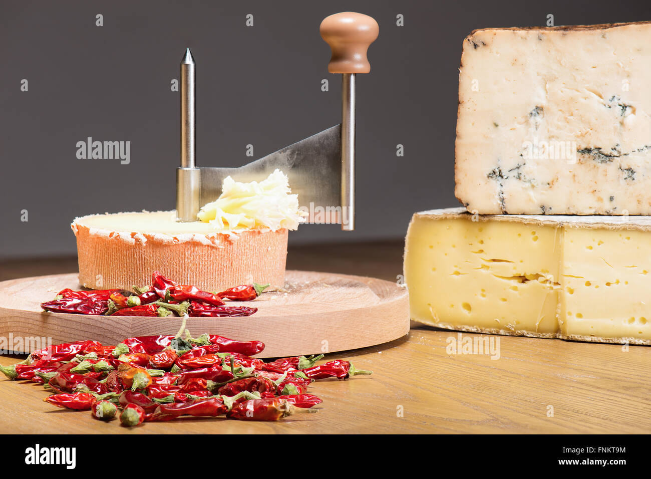 italian cilento cheese with manual machine for cutting on wood table Stock Photo