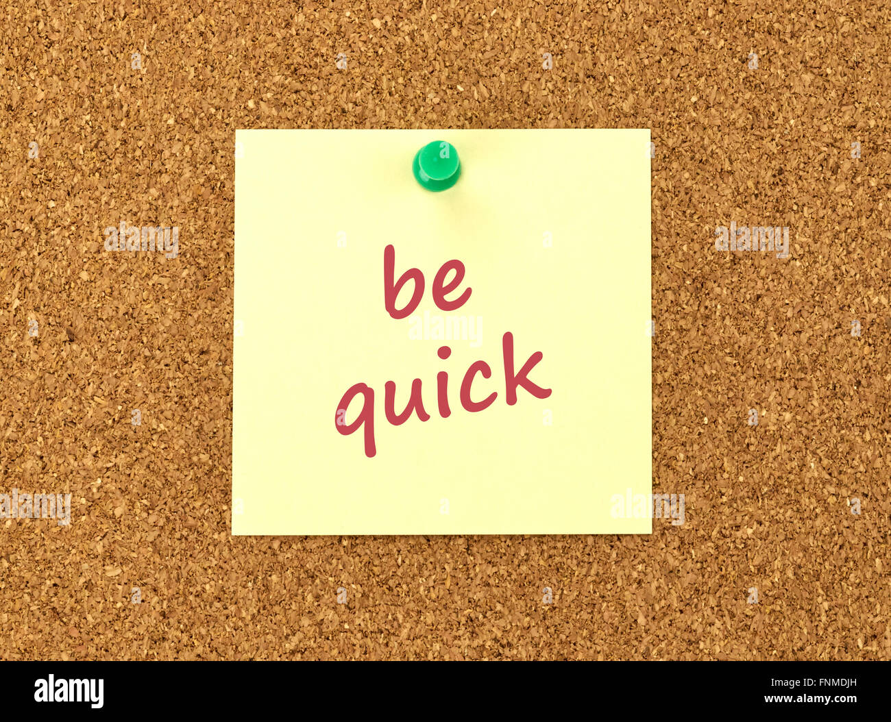 The phrase Be Quick in red text on a yellow sticky note posted to a ...