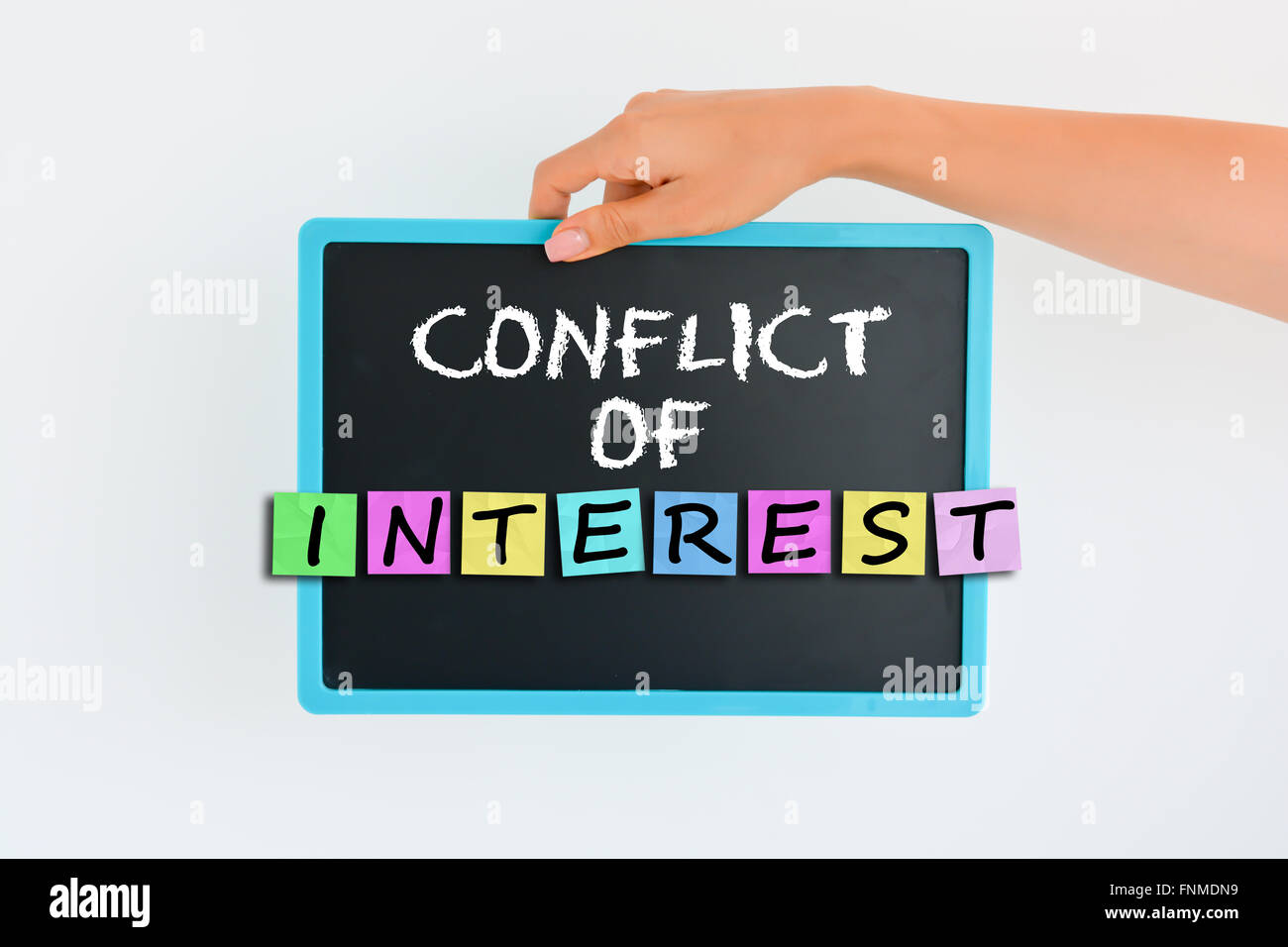 Conflict of interest concept on small blackboard Stock Photo