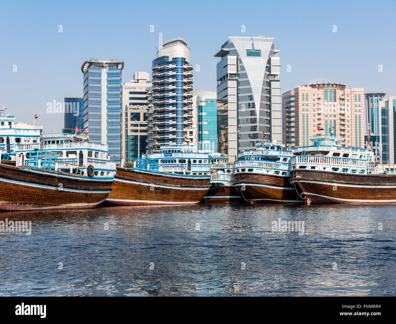 Deira Dhow Wharfage in Rigga Al Buteen. View from The Creek with Hilton Dubai Creek (L) and Saleh Al-Gurg Tower (R), Dubai, UAE Stock Photo