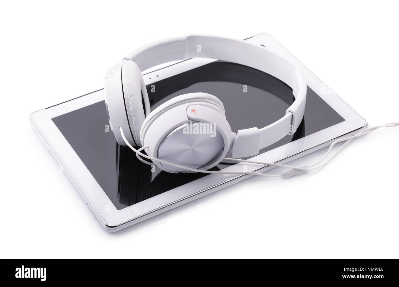 Tablet PC and headphones isolated on white Stock Photo