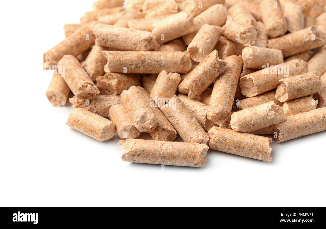 Close up of wood pellets on white background Stock Photo