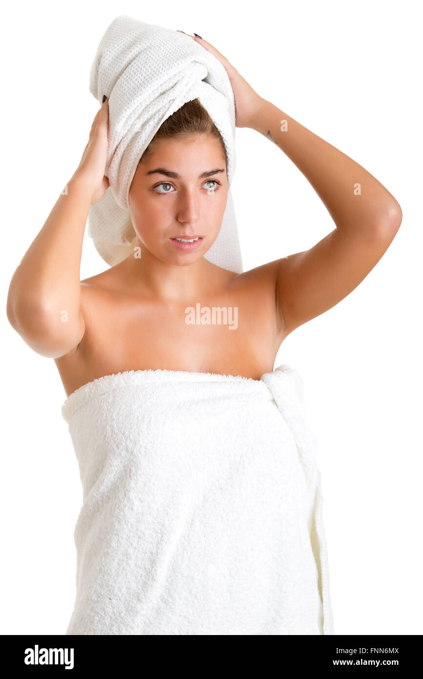 Woman with a towel wrapped around her head, isolated in white Stock Photo