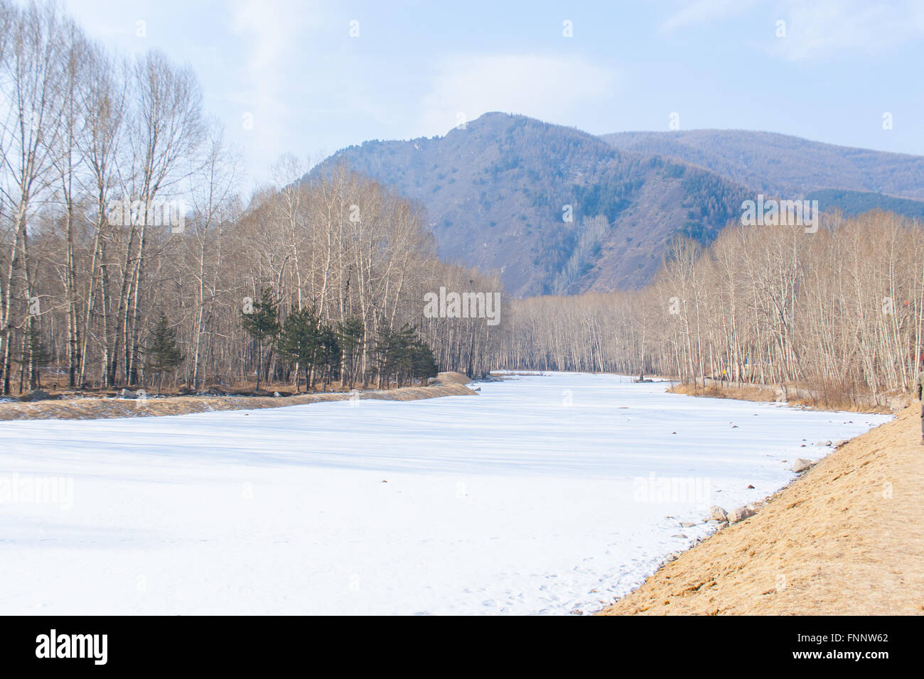 frozen river and mountain in northern China Stock Photo