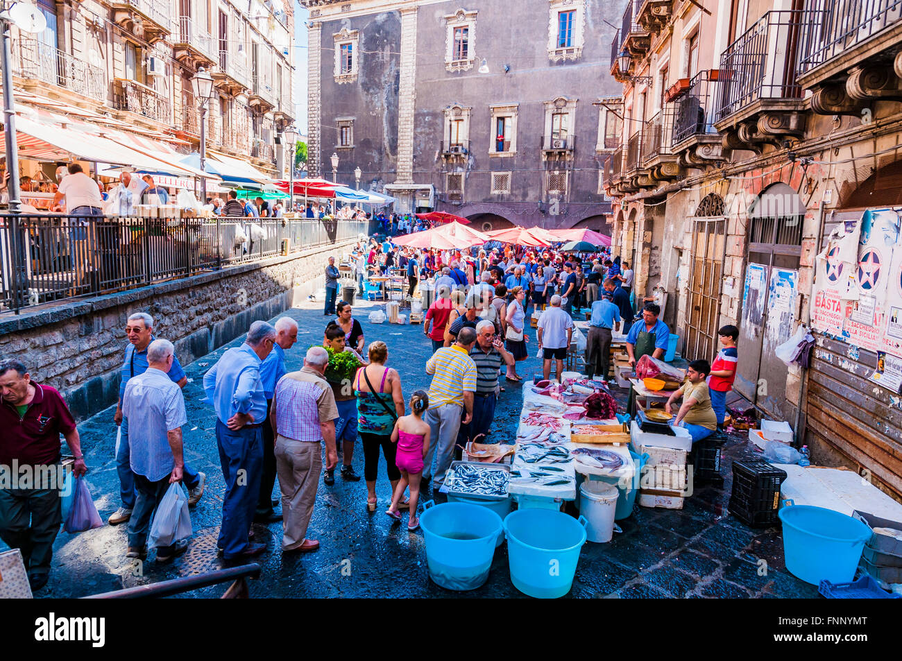 Sellers and buyers on the famous fish market in Catania. Greatest folkloric attractions of the city of Catania, Sicily, Italy Stock Photo