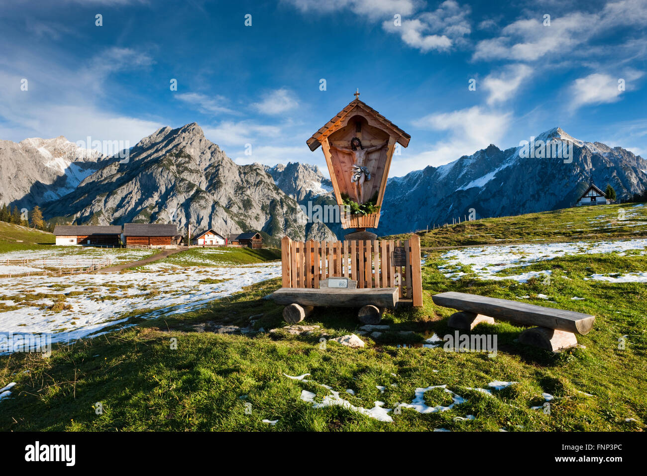 Way-side cross in front of Walder Alm and Karwendel Mountains, Tyrol, Austria Stock Photo