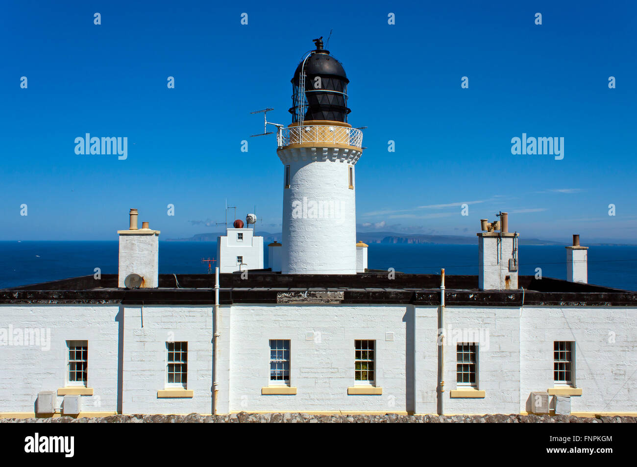 dunnet head lighthouse, scotland UK on a bright, sunny, cloudless day Stock Photo